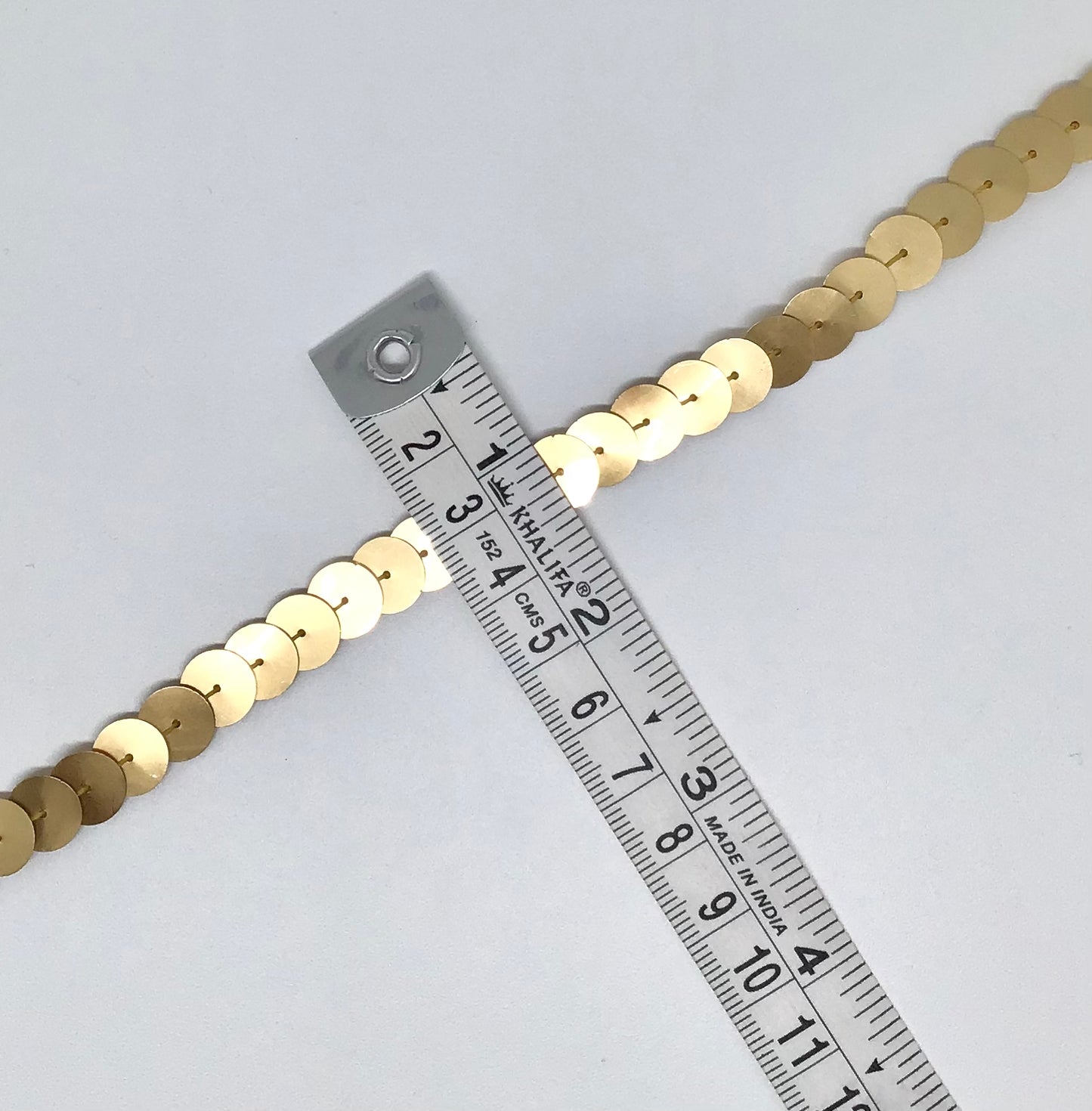 10 mm gold sequins in a continuous line