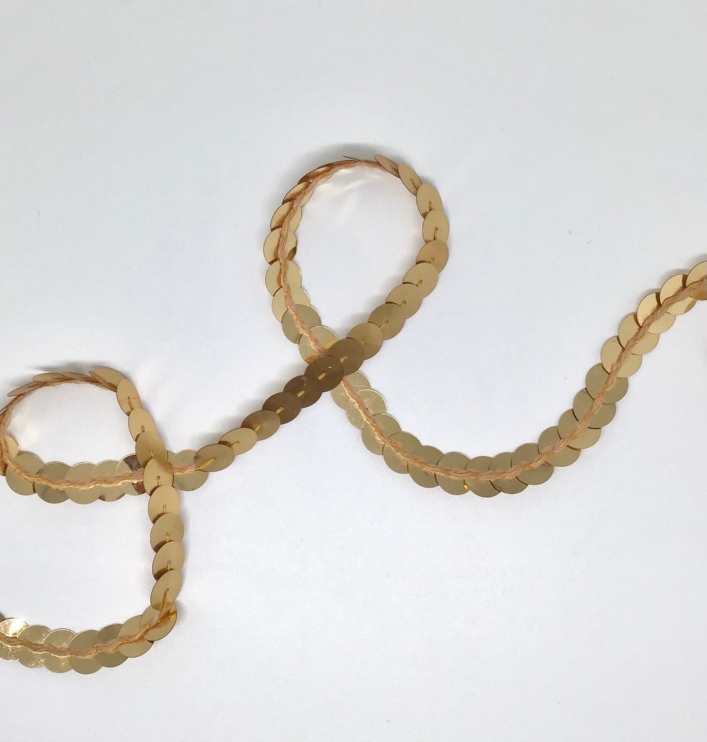 10 mm gold sequins in a continuous line