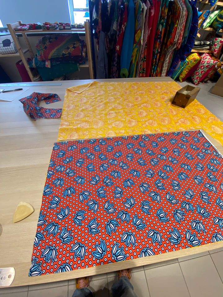 Colourful print fabrics laid out ready to be made into a lined tote bag