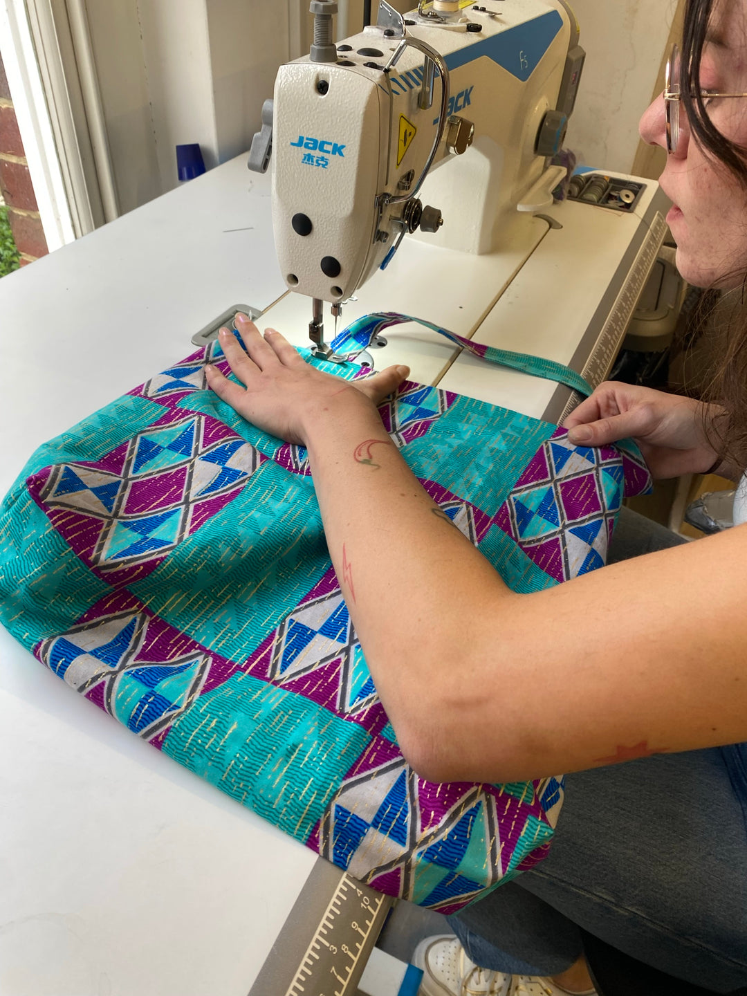 Sewing a lined tote bag on a sewing machine at the Violet Elizabeth studio